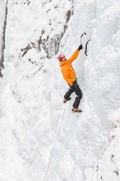 Ice climber on a frozen waterfall
