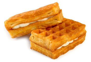 Pair of fresh soft belgian waffles isolated on white background, close up.