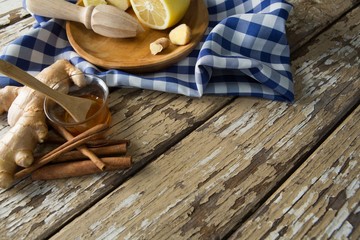High angle view of various food with checked napkin on weathered