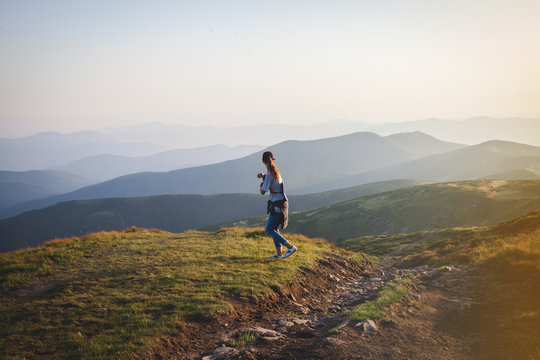 Girl Hiker Walks into  Mountains