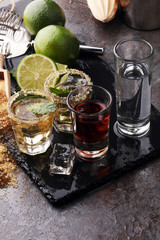 Selection of alcoholic drinks on rustic stone plate