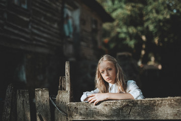 Little Girl In Front Of old House