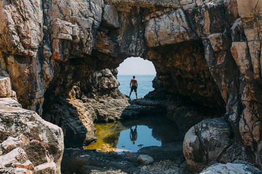 Reflection of a man in a cave
