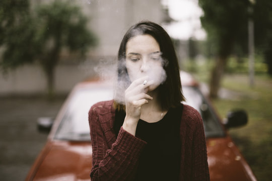 portrait of real young smoking woman