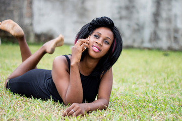 young woman talking on the phone in the park