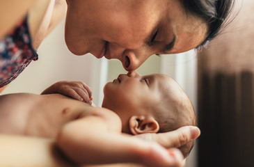 Portrait of mother with newborn son