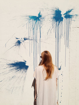 Girl with abstract wall