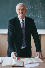 Portrait of a mature professor in a classroom