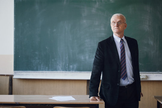 Portrait of a mature professor in a classroom