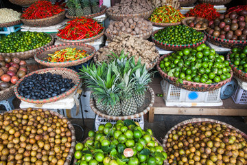 tropical spices and fruits sold at a local market in Hanoi (Vietnam)