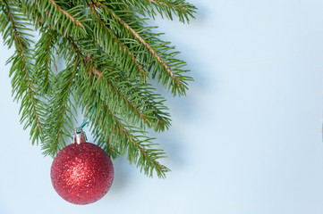 Composition of Christmas decorations on a spruce branch and toning.