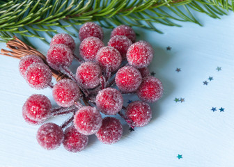 Composition of Christmas decorations on a spruce branch and toning.