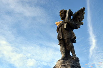 Religious statue in cemetery 