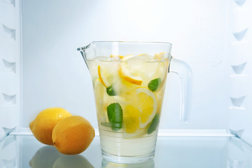 Jug of fresh lemonade in fridge