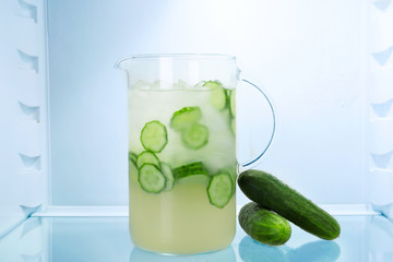 Jug of fresh cucumber lemonade in fridge