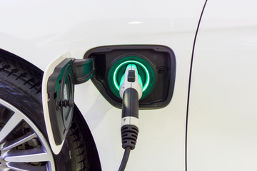 Close up Power supply connect to electric car for add charge to the battery. Charging re technology...