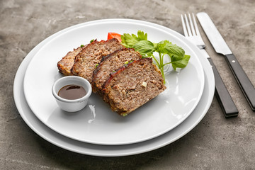 Sliced tasty turkey meatloaf served for dinner on table