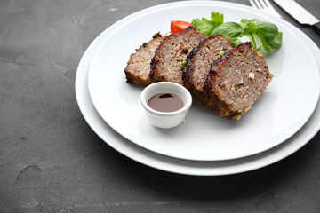 Sliced tasty turkey meatloaf served for dinner on table