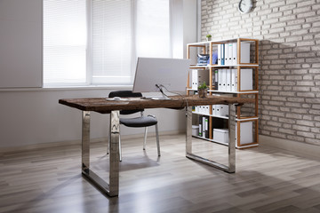 Computer On Desk In Modern Office