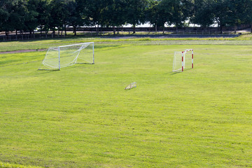 Obraz premium Green lawn with a football goal.