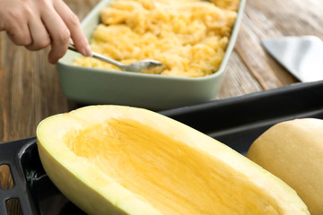 Fresh spaghetti squash on baking sheet