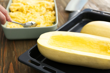 Fresh spaghetti squash on baking sheet