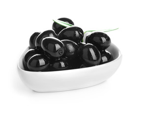 Bowl with ripe olives on white background