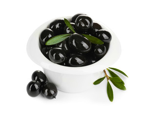 Bowl with ripe olives on white background