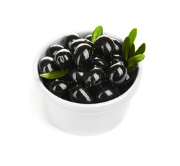Bowl with ripe olives on white background