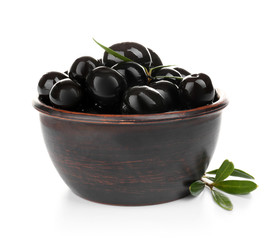 Bowl with ripe olives on white background
