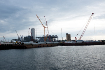 Cranes in boatyard in Salem Harbor