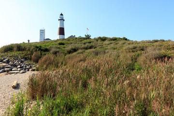 Fototapeta na wymiar Montauk Point lighthouse on the beach on Long Island, New York