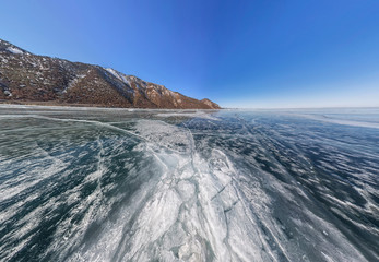 crack on the ice of Lake Baikal from Olkhon. Wide-angle panorama