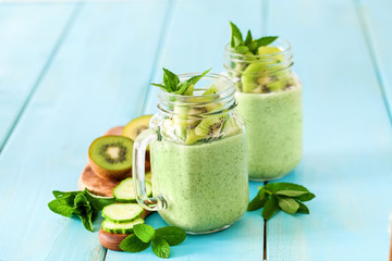 Green smoothie with kiwi fruit, cucumber, mint