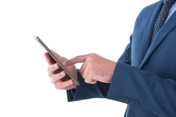 Mid sectiong of businessman using tablet pc