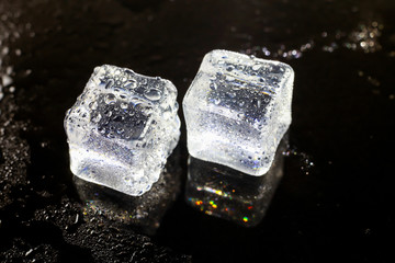 Obraz premium ice cubes on black background.