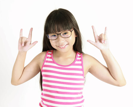 Little Asian girl wearing glasses with hand love sign isolated