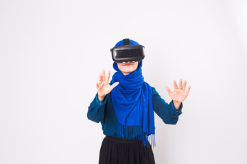 Muslim woman using VR headset. technology, vr, people and game concept