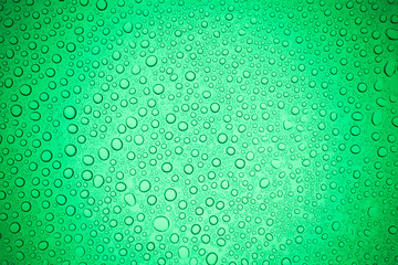 Rain droplets on green glass background, Water drops on glass.