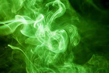 Green smoke movement on black background.