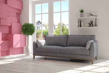 Fototapeta premium Idea of white room with sofa and summer landscape in window. Scandinavian interior design. 3D illustration