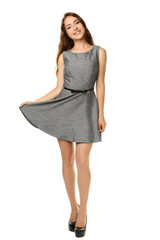 Portrait of young woman in dress on white background