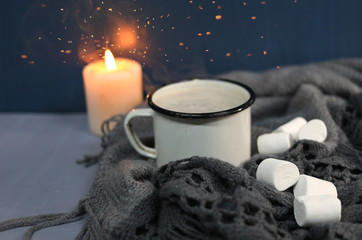 hot milk, marshmallow and a burning candle.