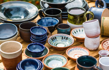 Ukrainian pottery. Pottery museum in Ukrainian village Oposhnya, center of Ukrainian pottery production. Different pottery products: bowls, pitchers, plates in museum.