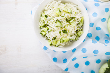 Salad with kohlrabi, cucumber and dill.