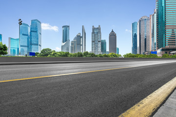 Fototapeta na wymiar cityscape and skyline of shanghai from empty asphalt road