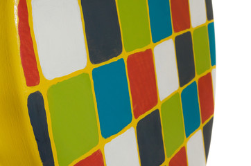 Handmade stool wooden yellow. Round seat wooden, painted in multicolored squares.