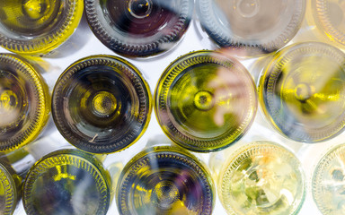 Wine bottles of red and white wine view from bottom