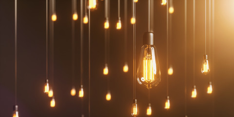 viele Edison Glühbirnen hängen im Raum und leuchten mit warmem Licht