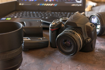 Fototapeta na wymiar Studio Photography with computers, cameras and flash